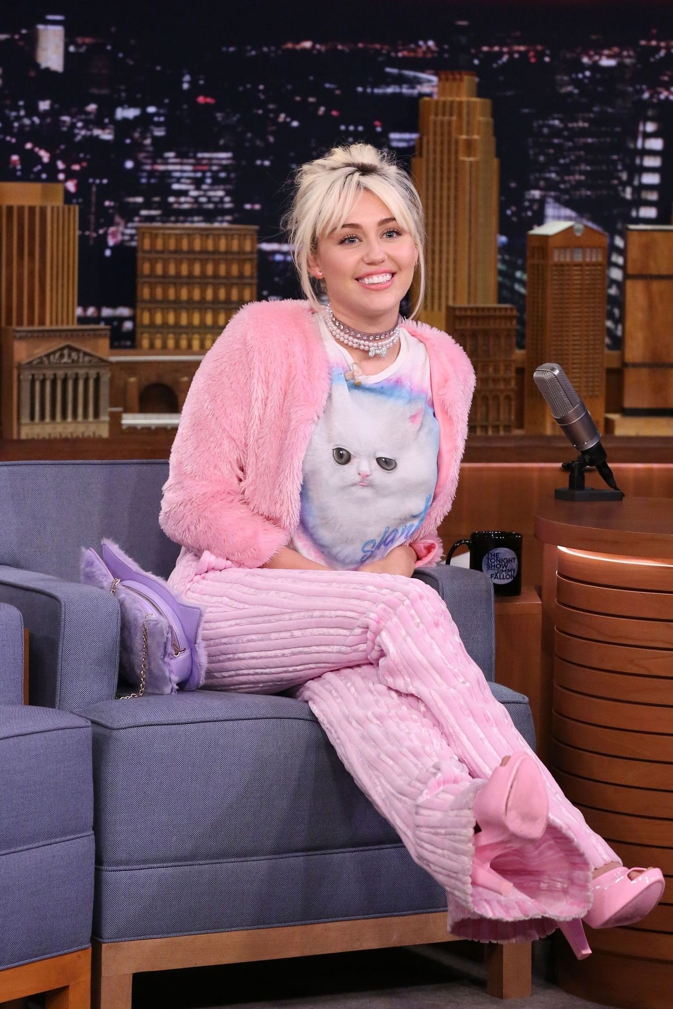 Miley Cyrus Sitting Wearing Cat-Themed Ensemble